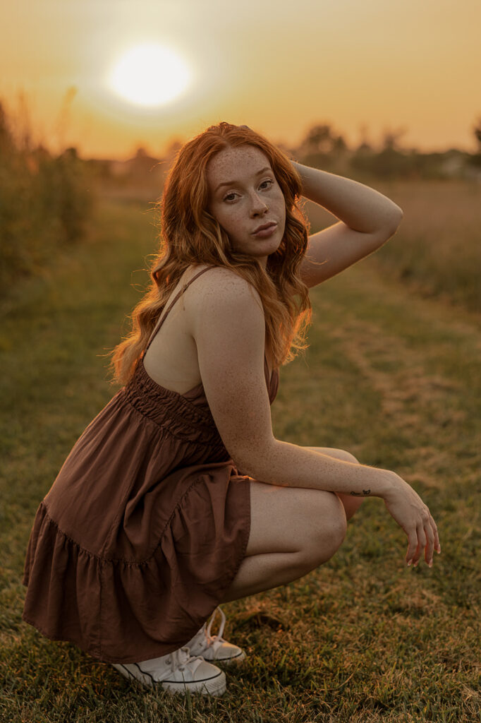 tall grass field senior photoshoot during golden hour