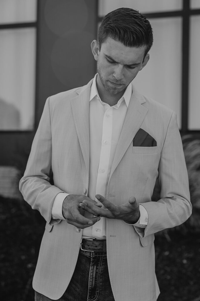 groom getting ready photos before outdoor wedding ceremony