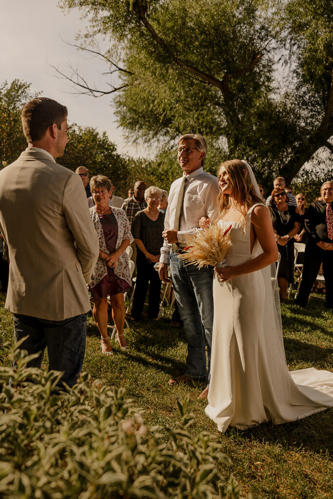 outdoor wedding ceremony in iowa at koru berry farms