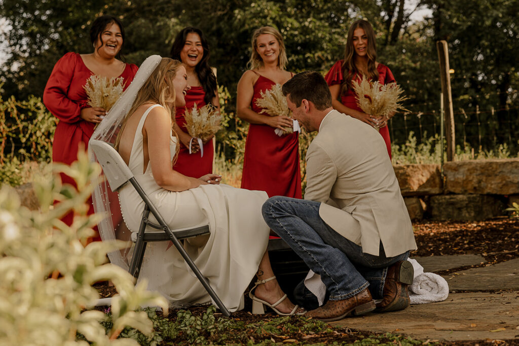 bride and groom washing each others feet christ centered wedding ceremony