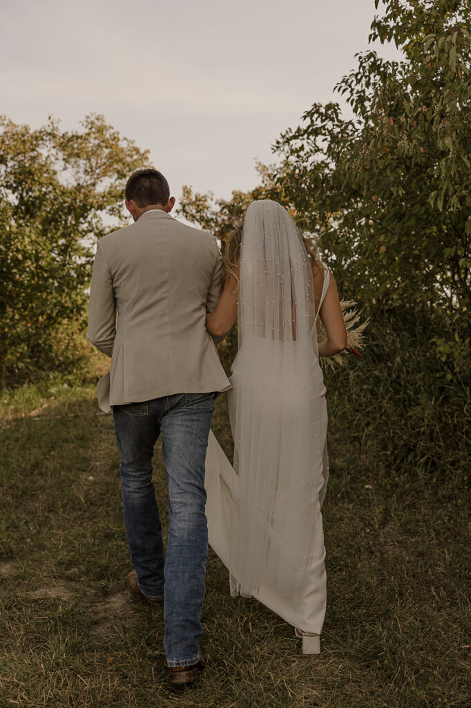 bride and groom walking and holding hands after ceremony