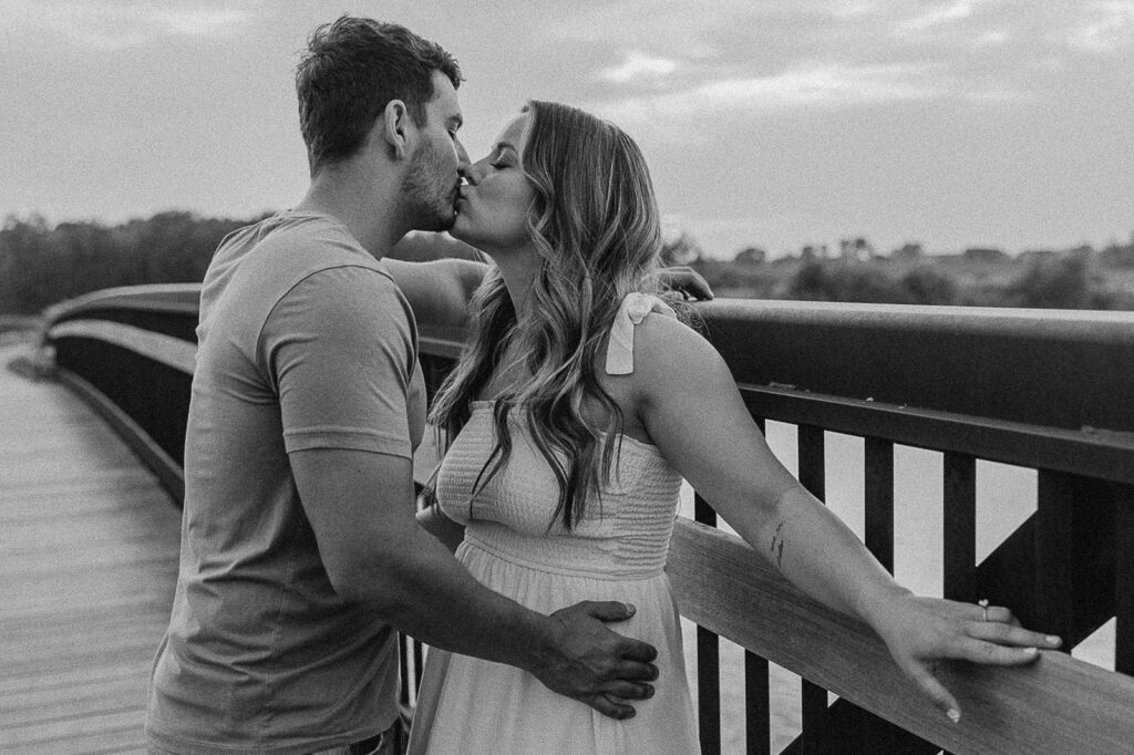 kissing pose on a bridge in iowa