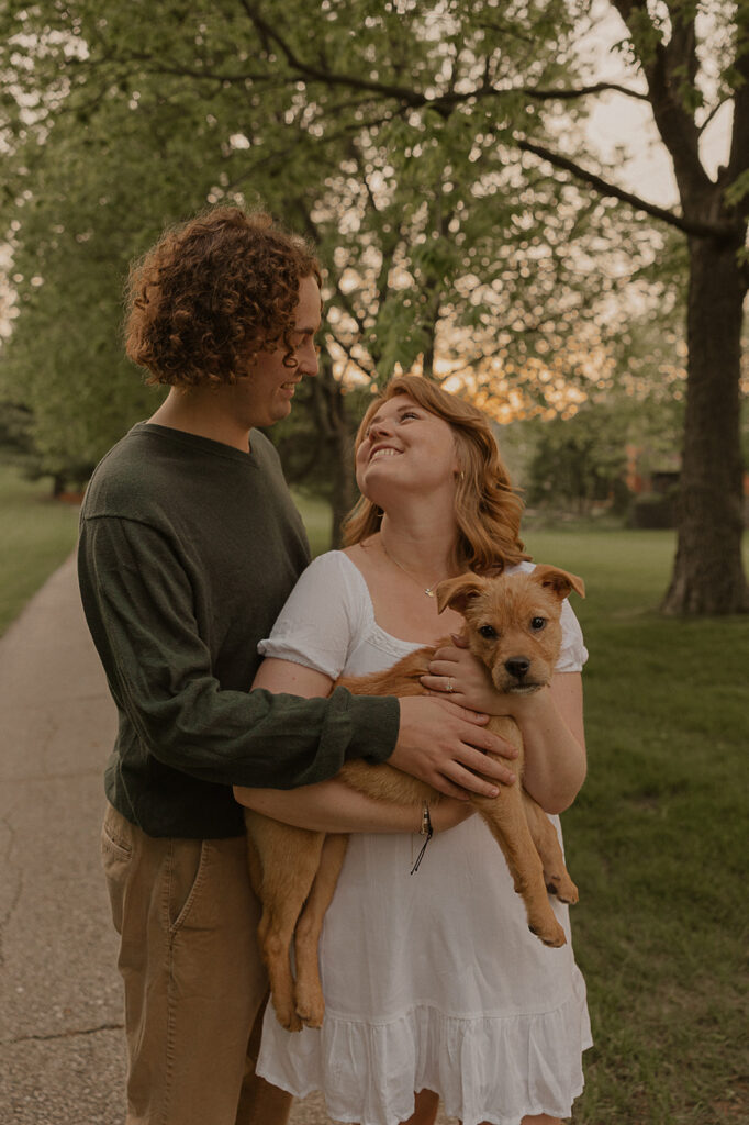 documentary style engagement photos in iowa with puppy