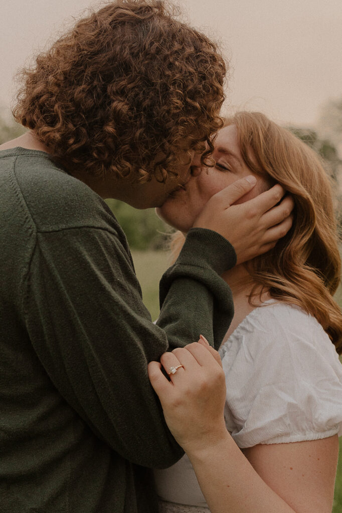 documentary style engagement photos in iowa with puppy