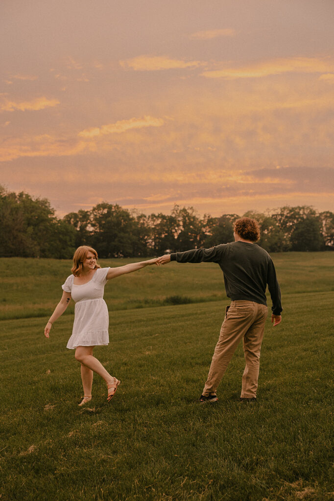 engagement in iowa couple smiling candid poses