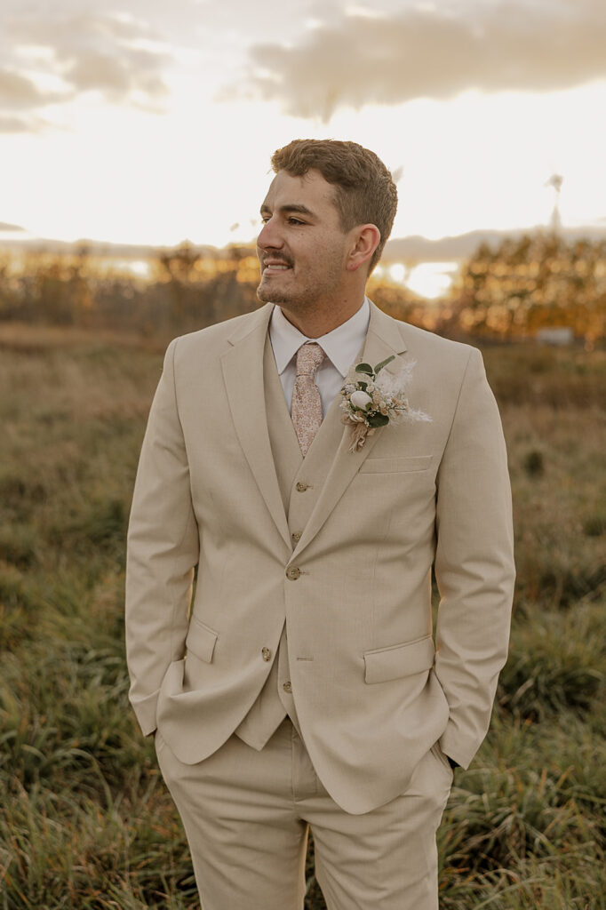 groom portraits outdoors golden hour