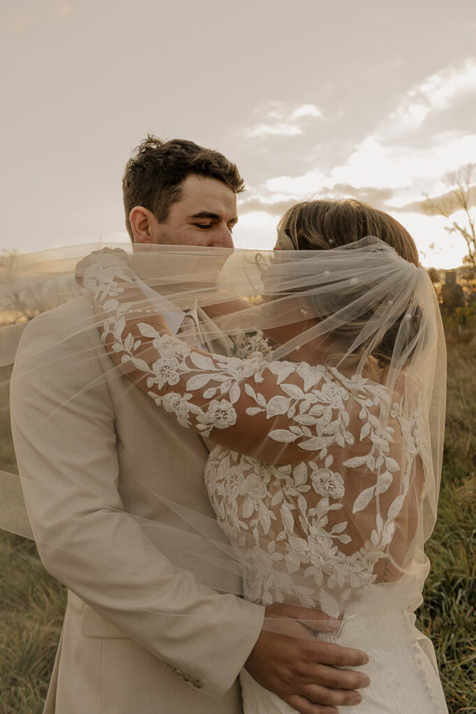 bridal portraits with wedding veil outdoors