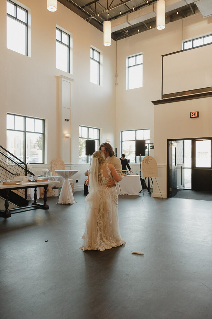 first dance with bride and groom during indoor wedding reception