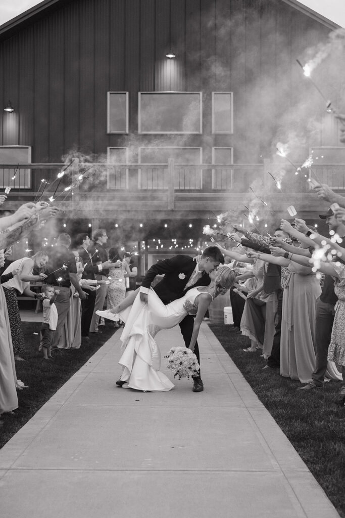 wedding sparkler exit dip pose bride and groom