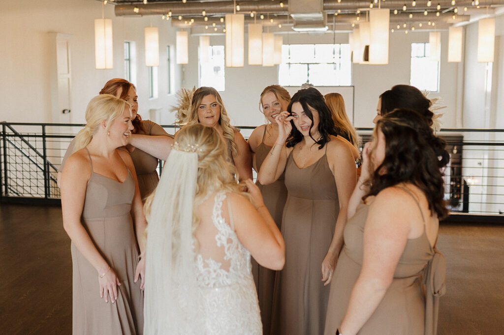 first look with bridesmaids in iowa