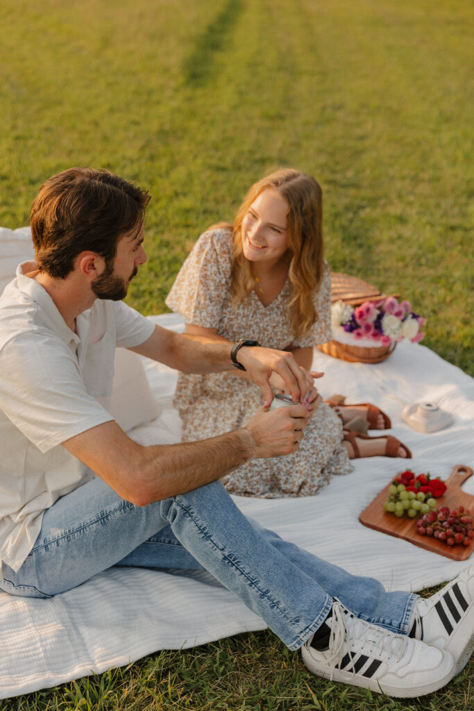 golden hour candid couple photos with a picnic