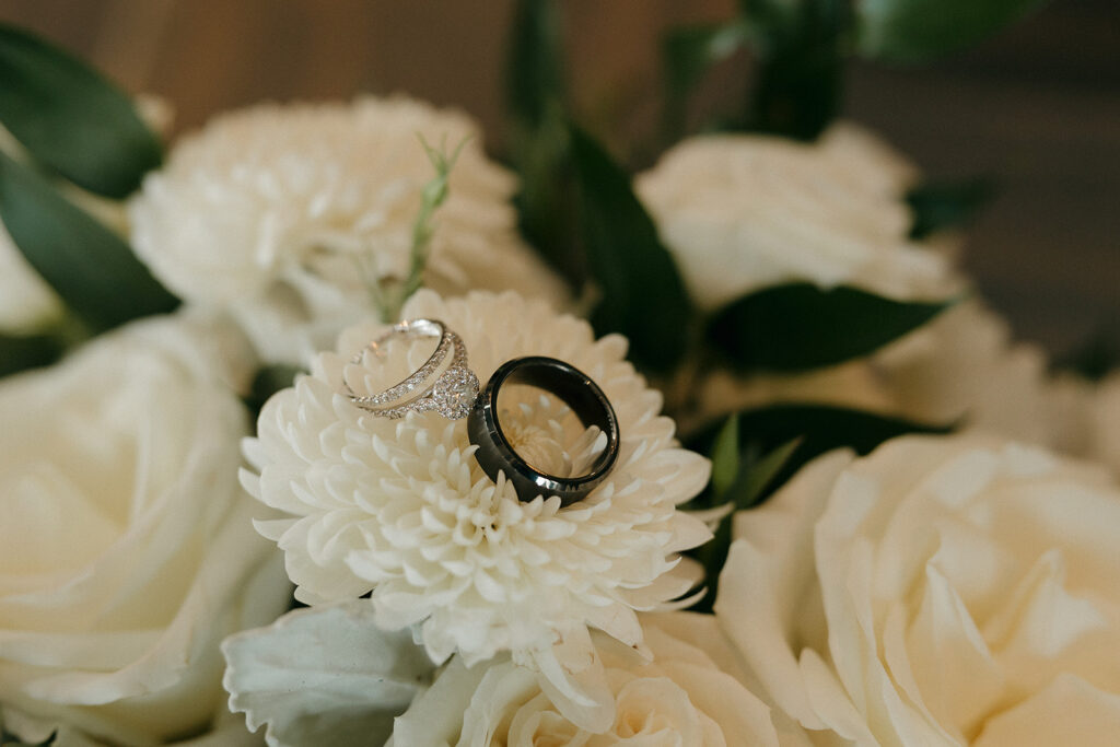 white wedding florals with rings