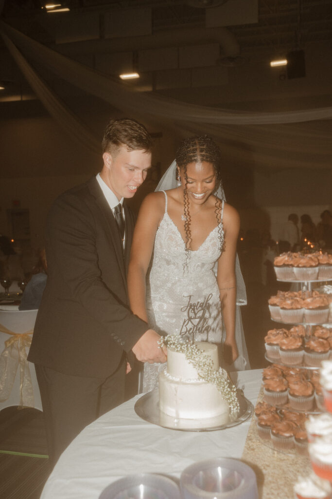 flash wedding reception photos bride and groom cutting cake