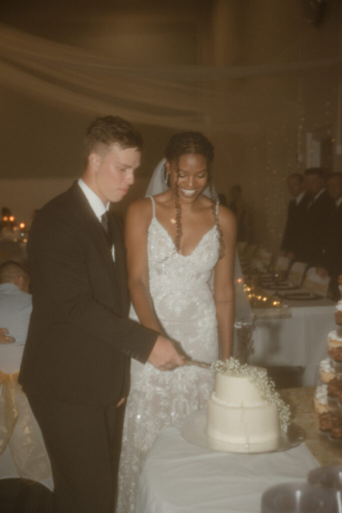 flash wedding reception photos bride and groom cutting cake