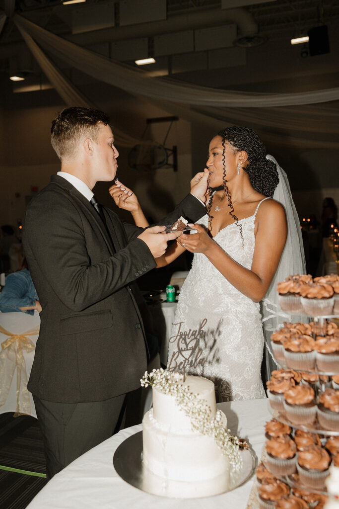 flash wedding reception photos bride and groom cutting cake