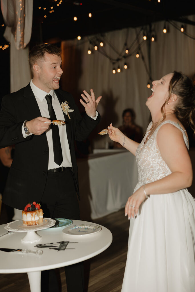 flash reception photos bride and groom cutting the cake