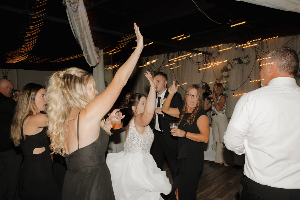 flash reception photos wedding guests dancing