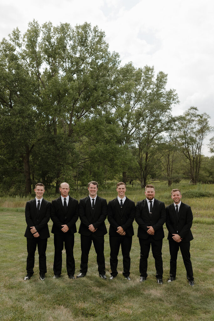 candid and timeless groomsmen photos iowa wedding photos