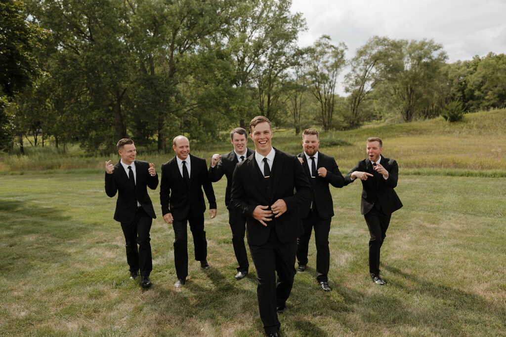 candid and timeless groomsmen photos iowa wedding photos