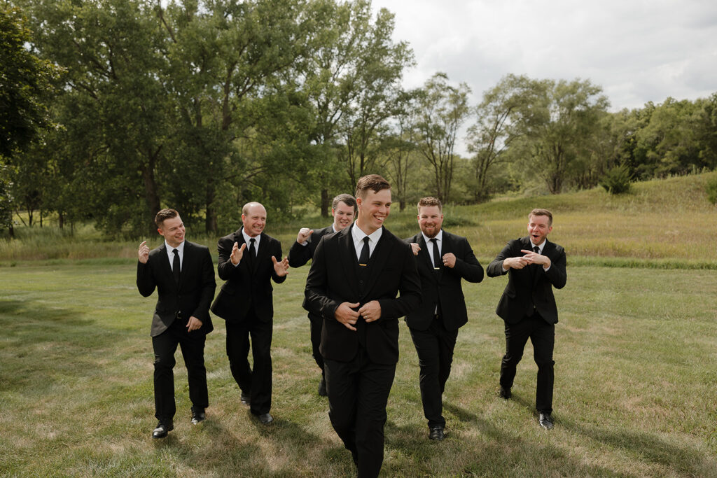 candid and timeless groomsmen photos iowa wedding photos