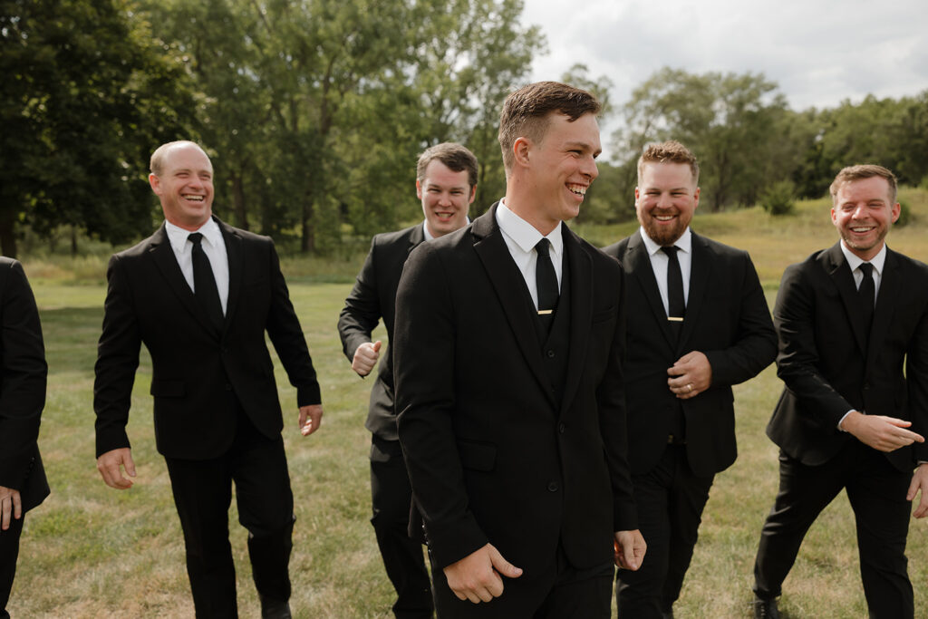 candid and timeless groomsmen photos iowa wedding photos