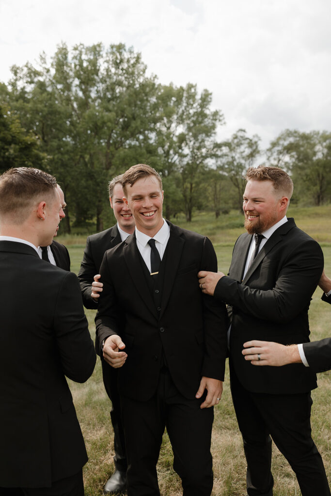 candid and timeless groomsmen photos iowa wedding photos