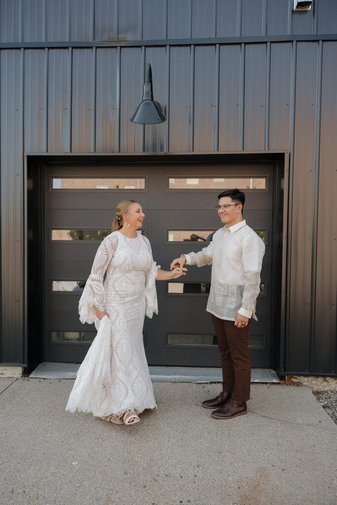 bride and groom portraits in front of garage