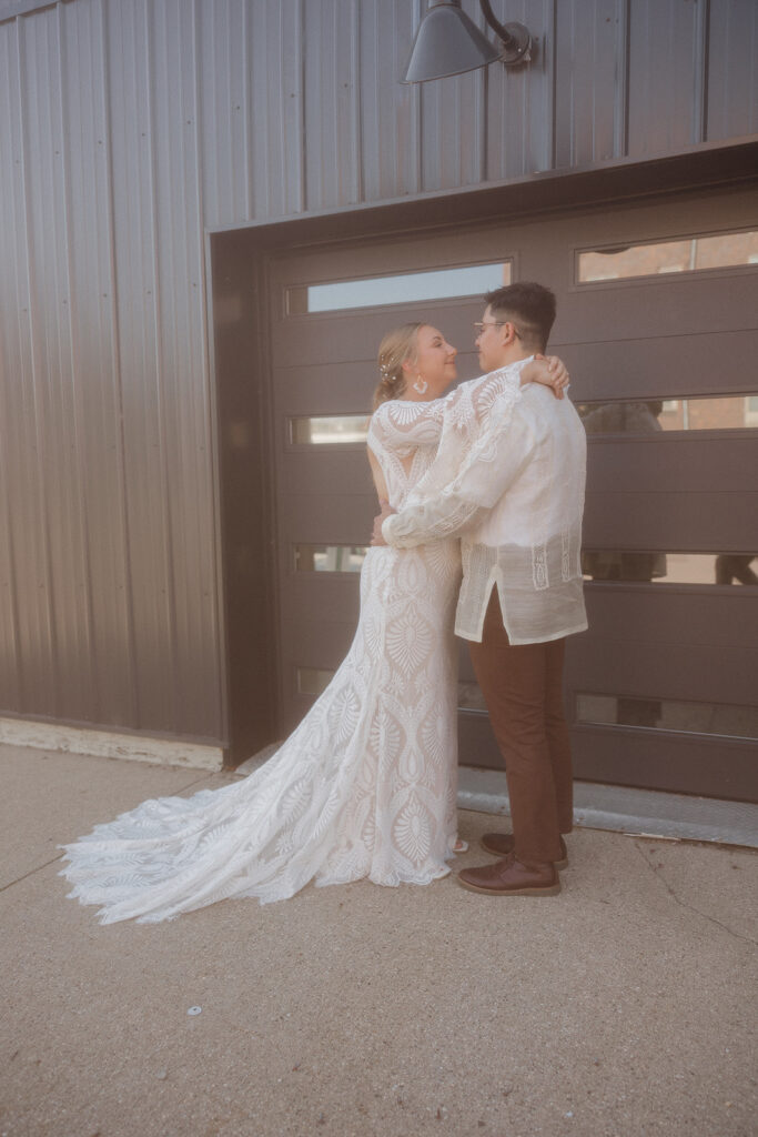 bride and groom portraits in front of garage