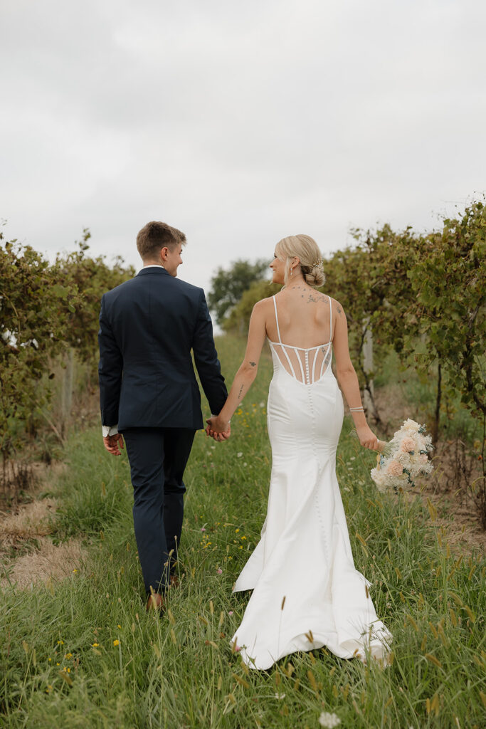 sunset wedding pictures with bride and groom in a vineyard