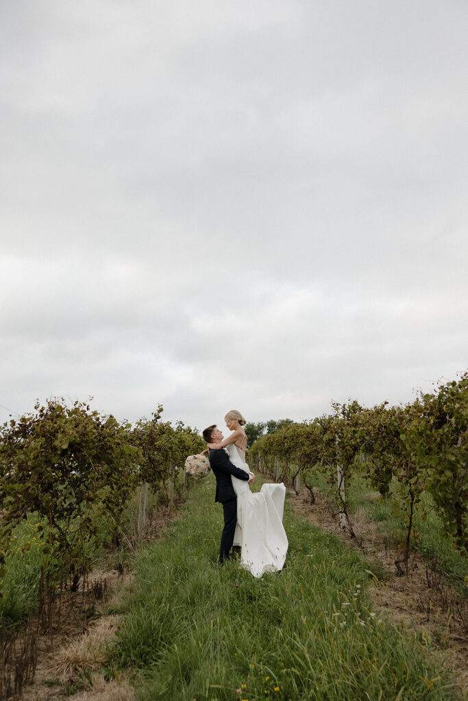 sunset wedding pictures with bride and groom in a vineyard