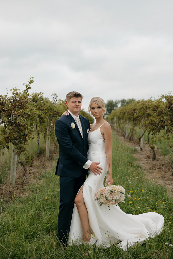 sunset wedding pictures with bride and groom in a vineyard