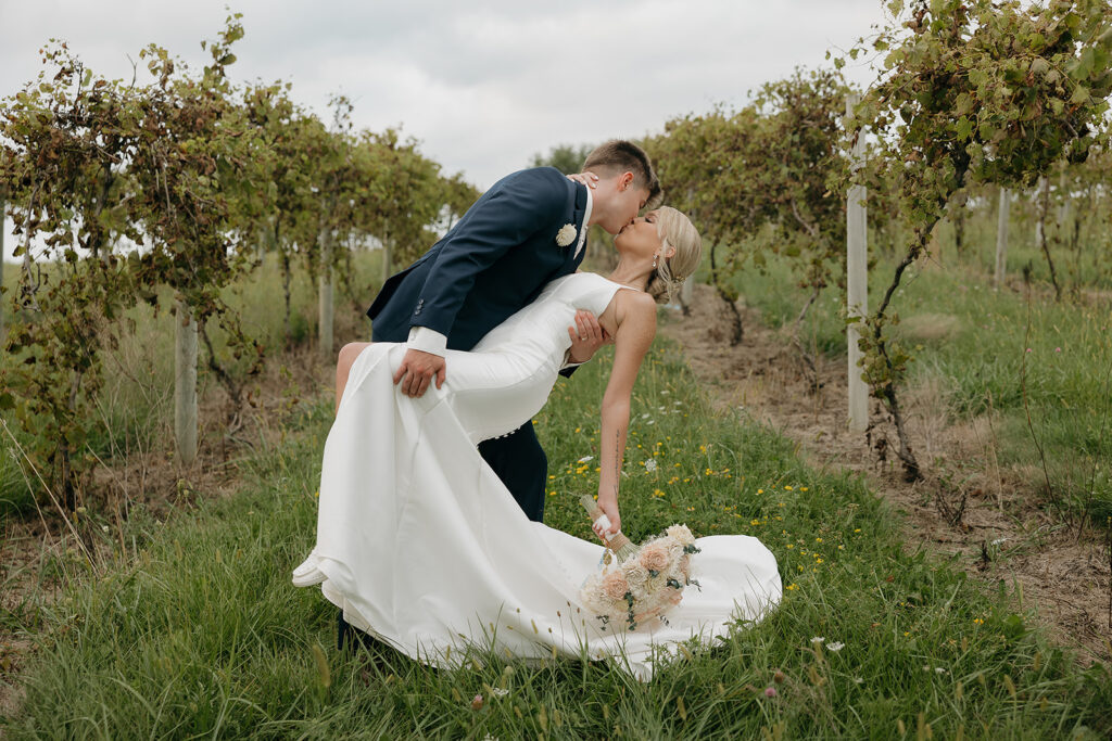 sunset wedding pictures with bride and groom in a vineyard