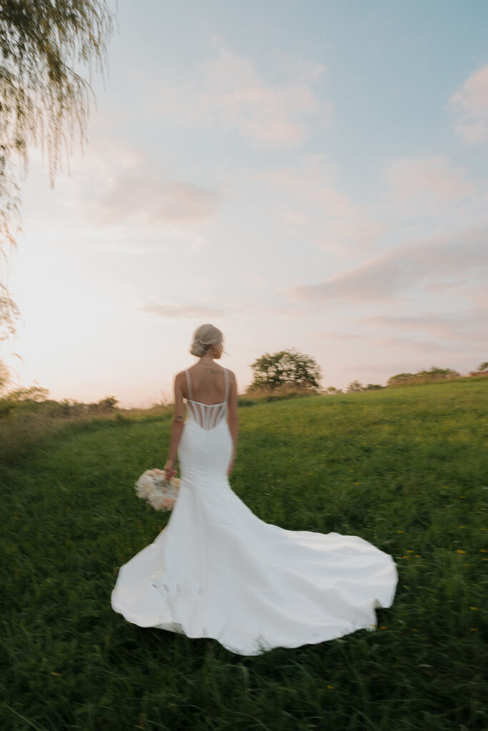 couple photos in front of willow tree during sunset after wedding ceremony