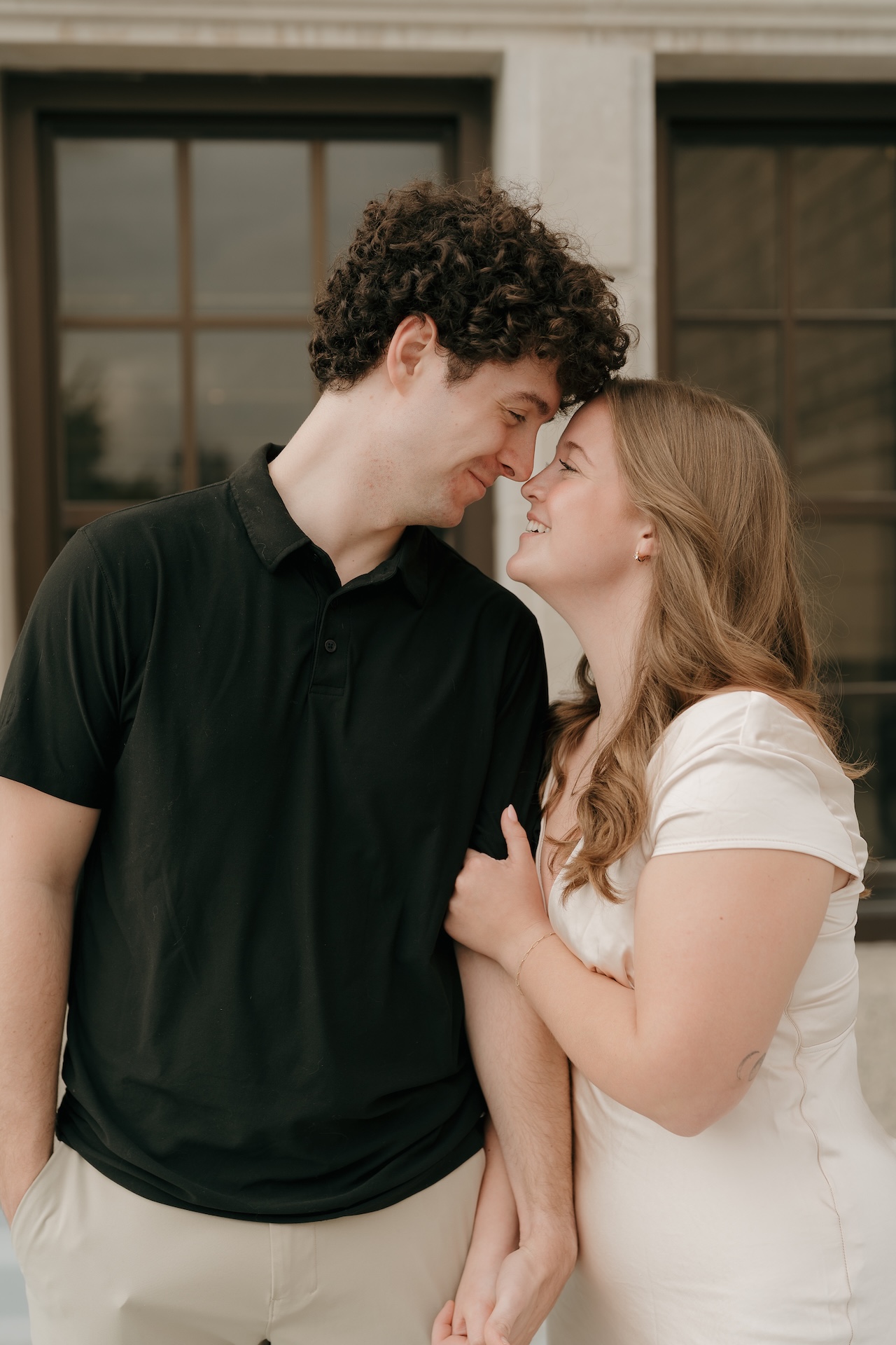 Close-up of a couple touching foreheads with the woman’s engagement ring visible, captured in an intimate moment at one of their chosen Engagement Photo Locations.