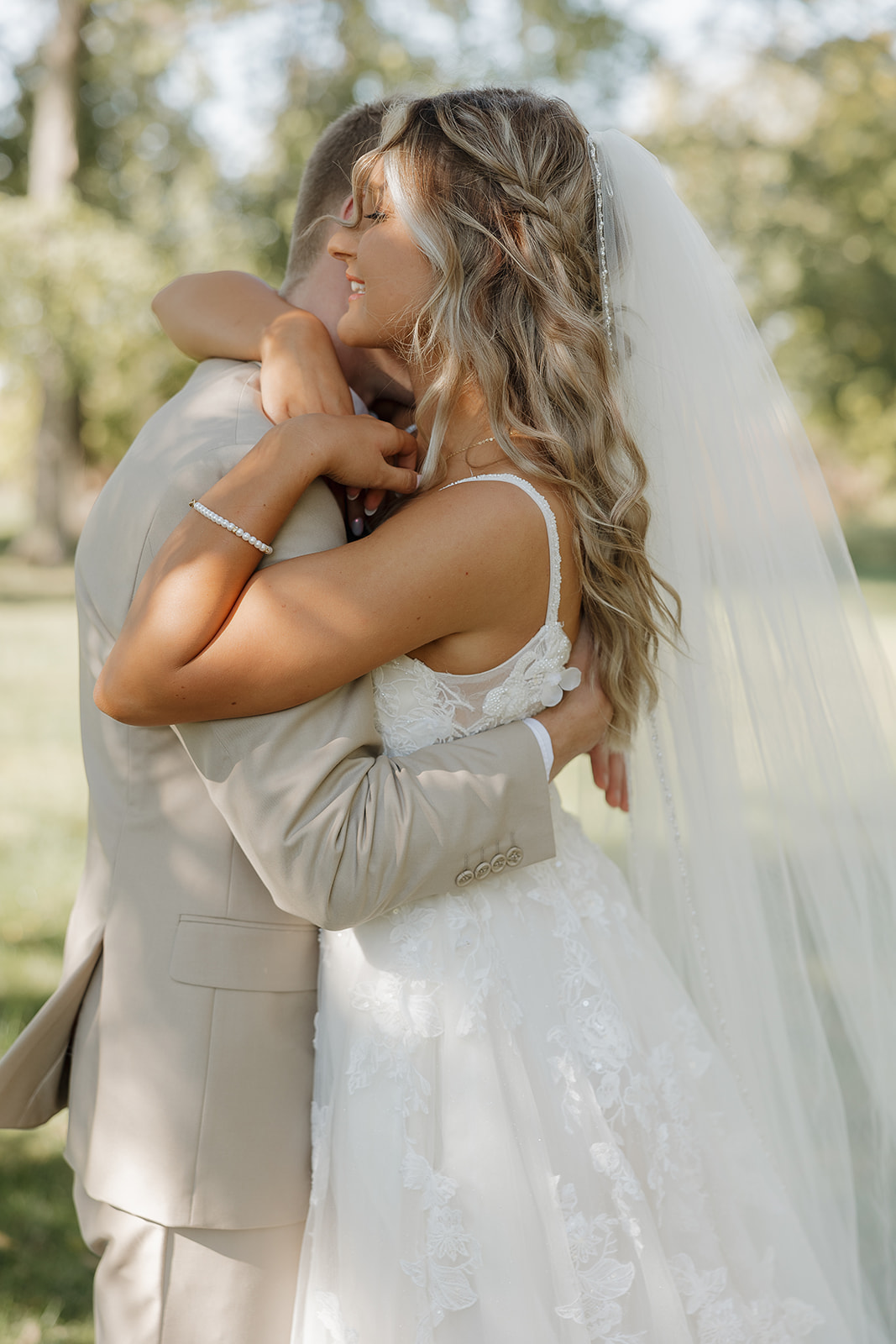 A joyful embrace between the couple, showing authentic connection and relaxed body language.