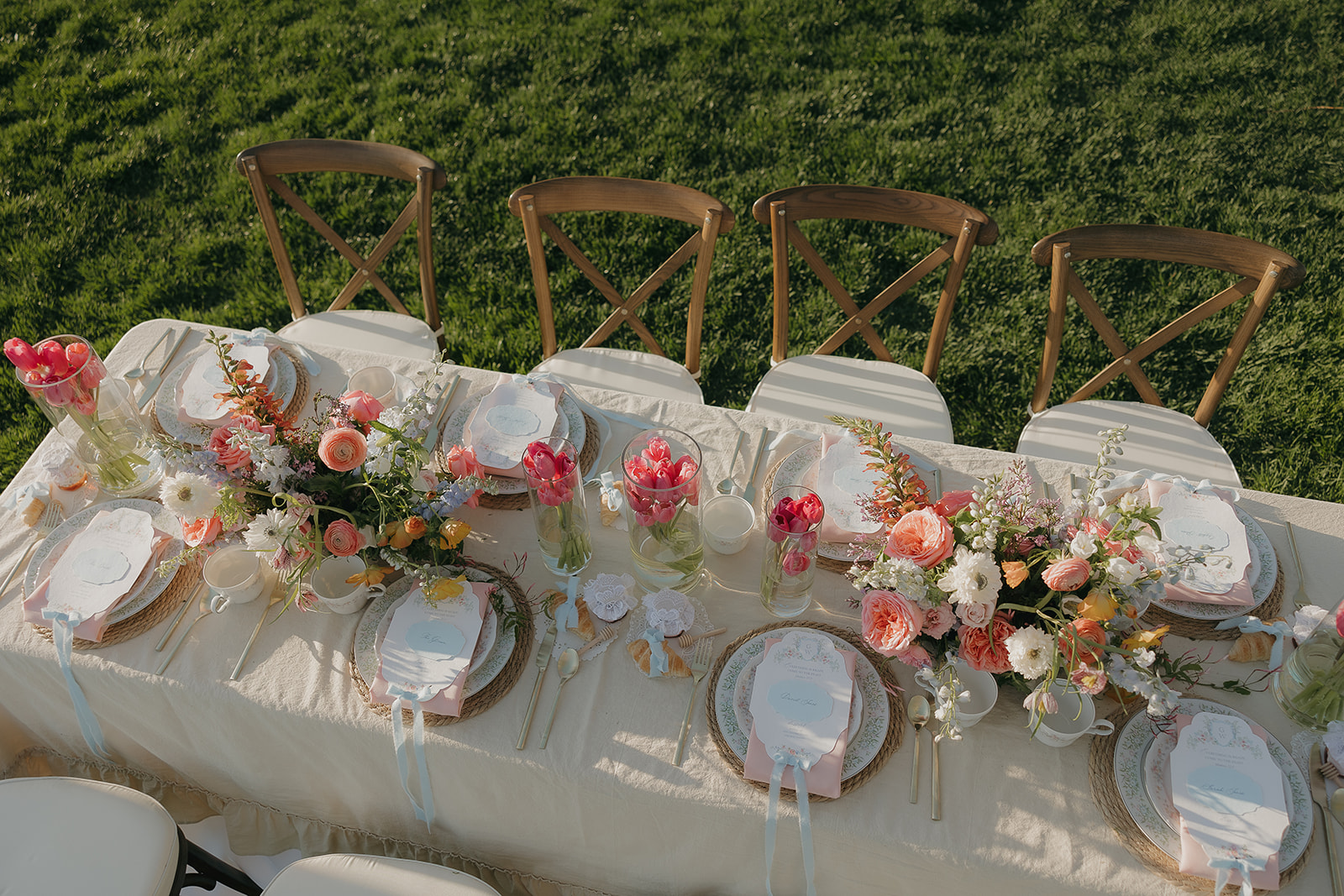 Colorful spring floral tablescape with pink and peach blooms
